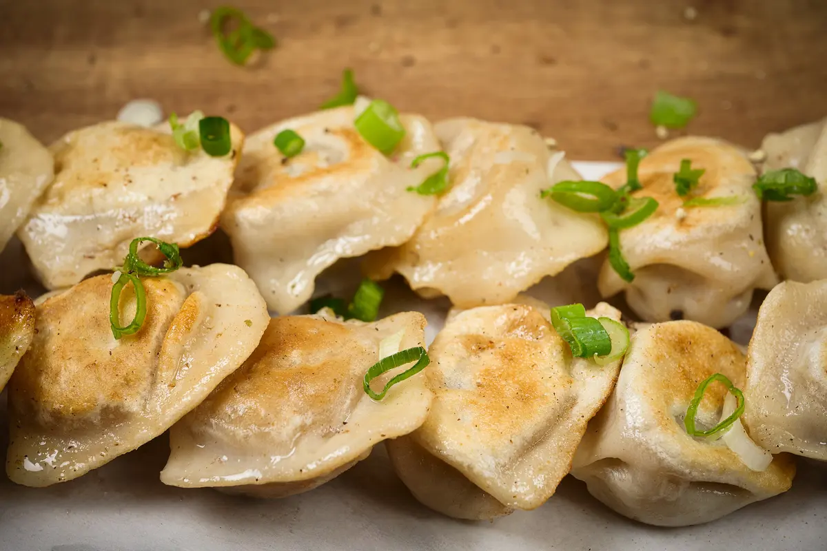 Golden pan-fried dumplings made at DL Eats